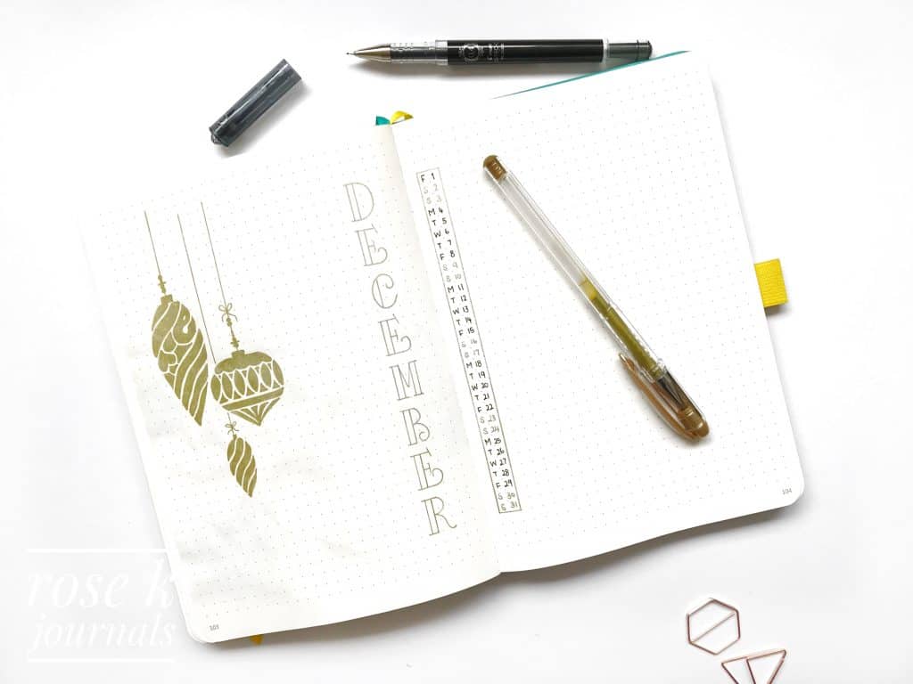 Rose K Journals bullet journal December Monthly log using gold pen to draw Christmas baubles